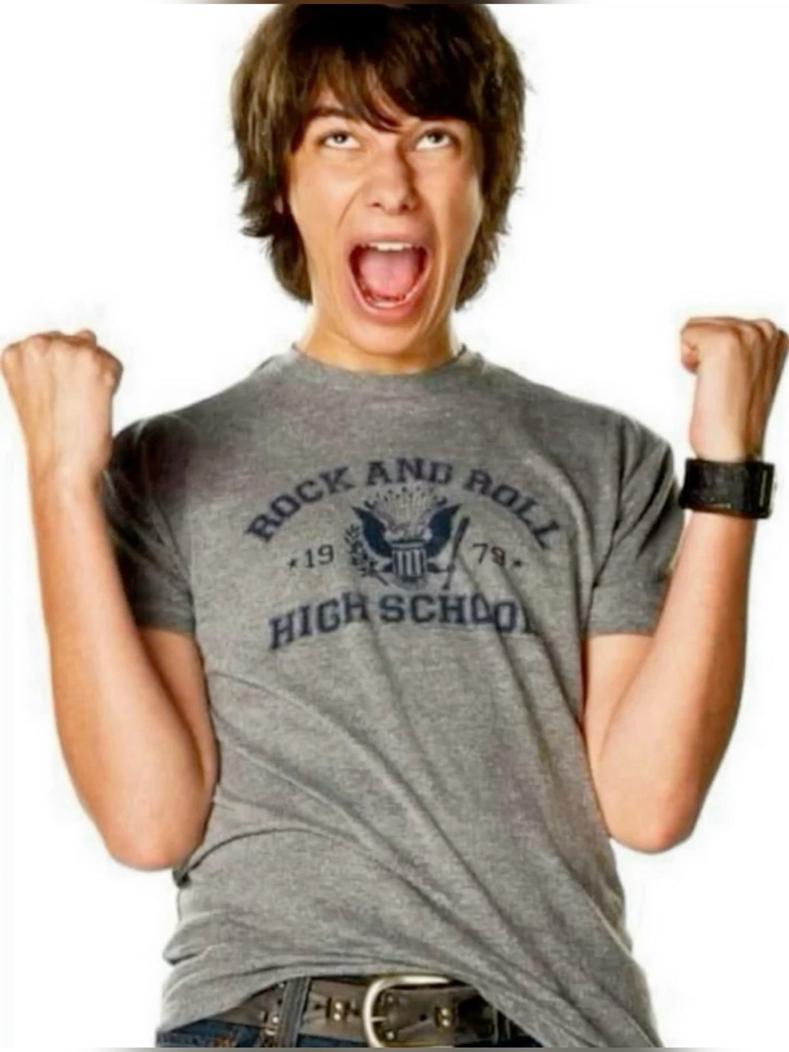 Shaggy-haired teen in a 'Rock and Roll High School' tee, fists up and yelling with joy