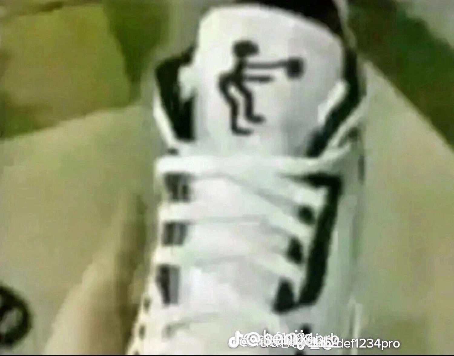 Bootleg sneaker with a stick figure squatting in place of the Jumpman logo