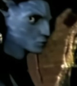 Blurry blue Avatar Na'vi face staring wide-eyed in the dark
