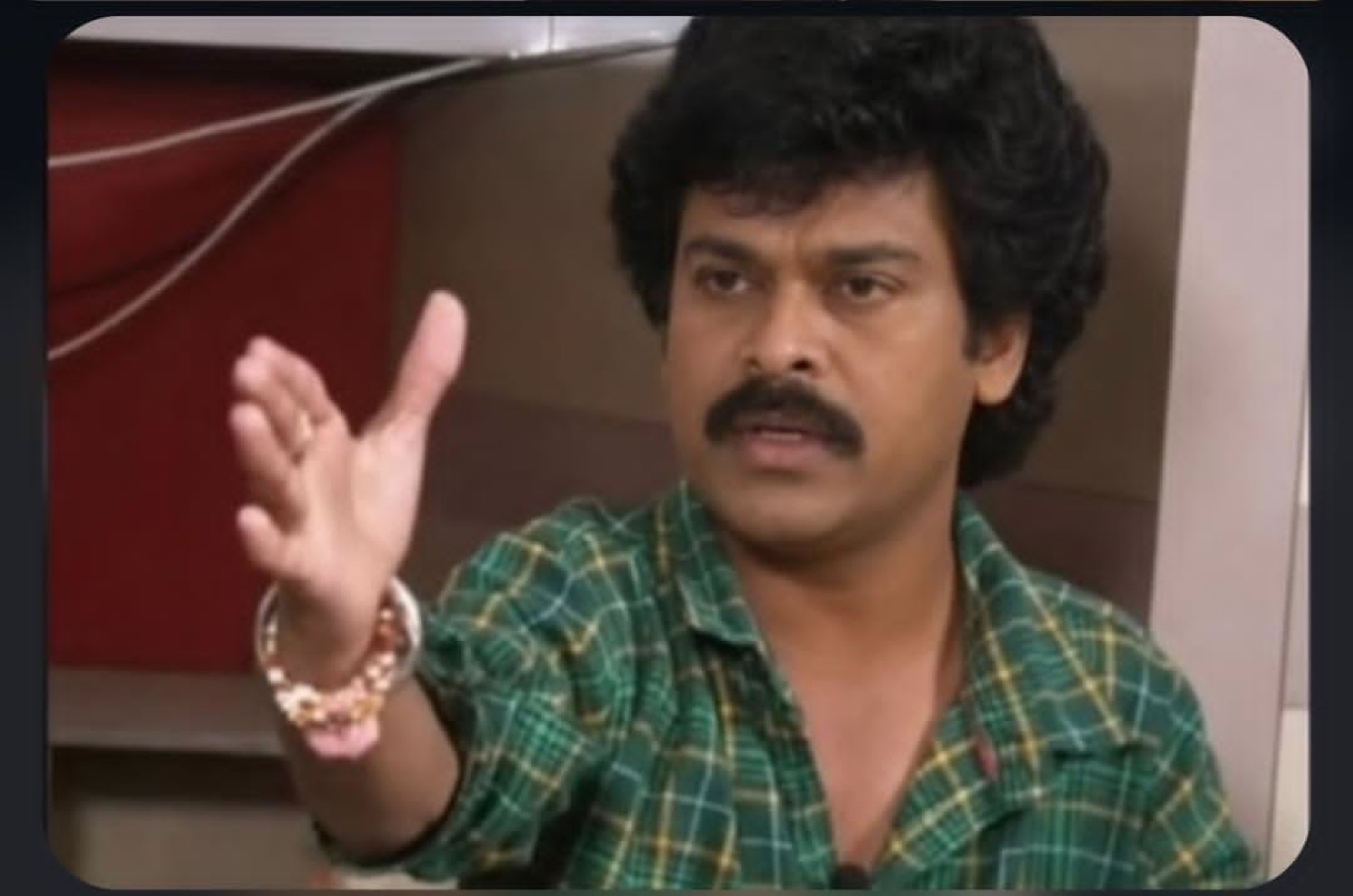 Man gesturing with an open palm mid-explanation