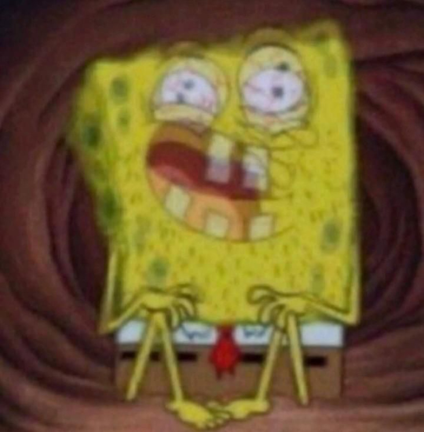 SpongeBob wheezing with bloodshot eyes and a huge strained laughing grin