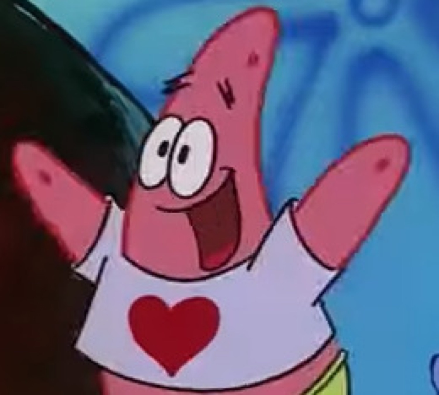 Patrick Star grinning wide with arms spread open wearing a heart T-shirt
