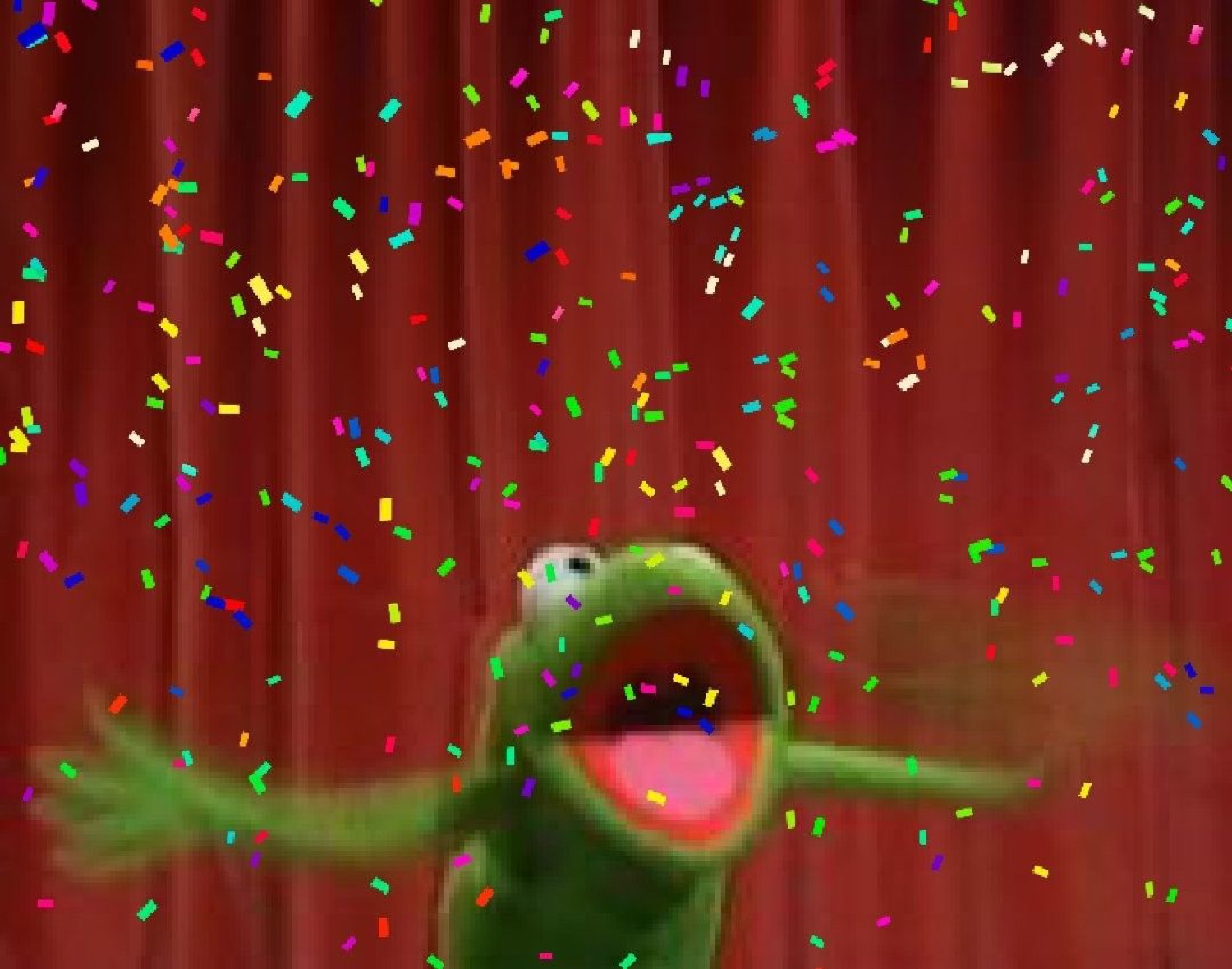 Kermit the Frog throwing his arms out joyfully as confetti rains down