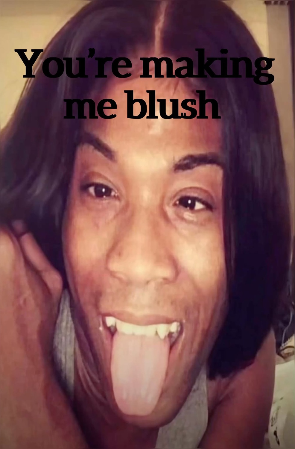 Person sticking out their tongue captioned 'You're making me blush'