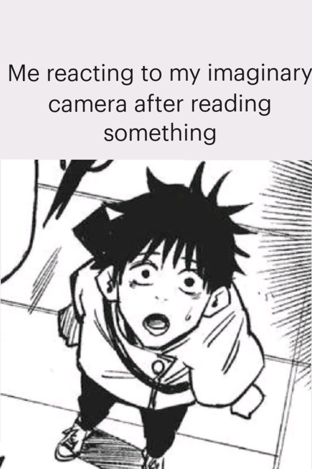 Wide-eyed manga boy looking up in shock, captioned about reacting to an imaginary camera