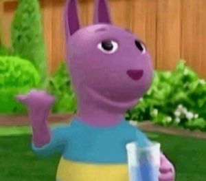 Austin from The Backyardigans holding a drink and raising one hand in a friendly wave