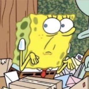 SpongeBob slumped among boxes looking tired, bored and thoroughly done