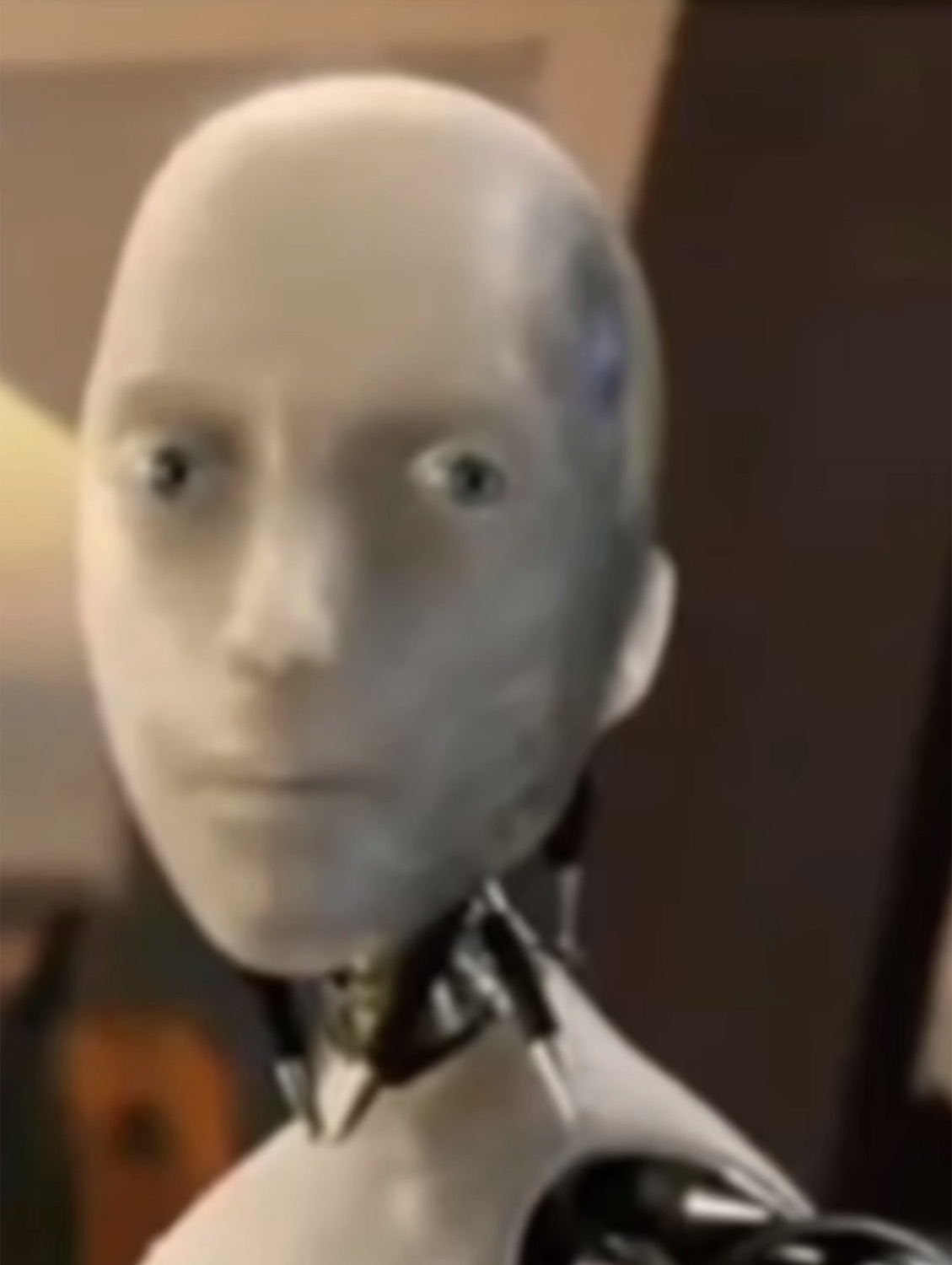 Humanoid robot from iRobot staring forward with an unsettlingly blank, emotionless face