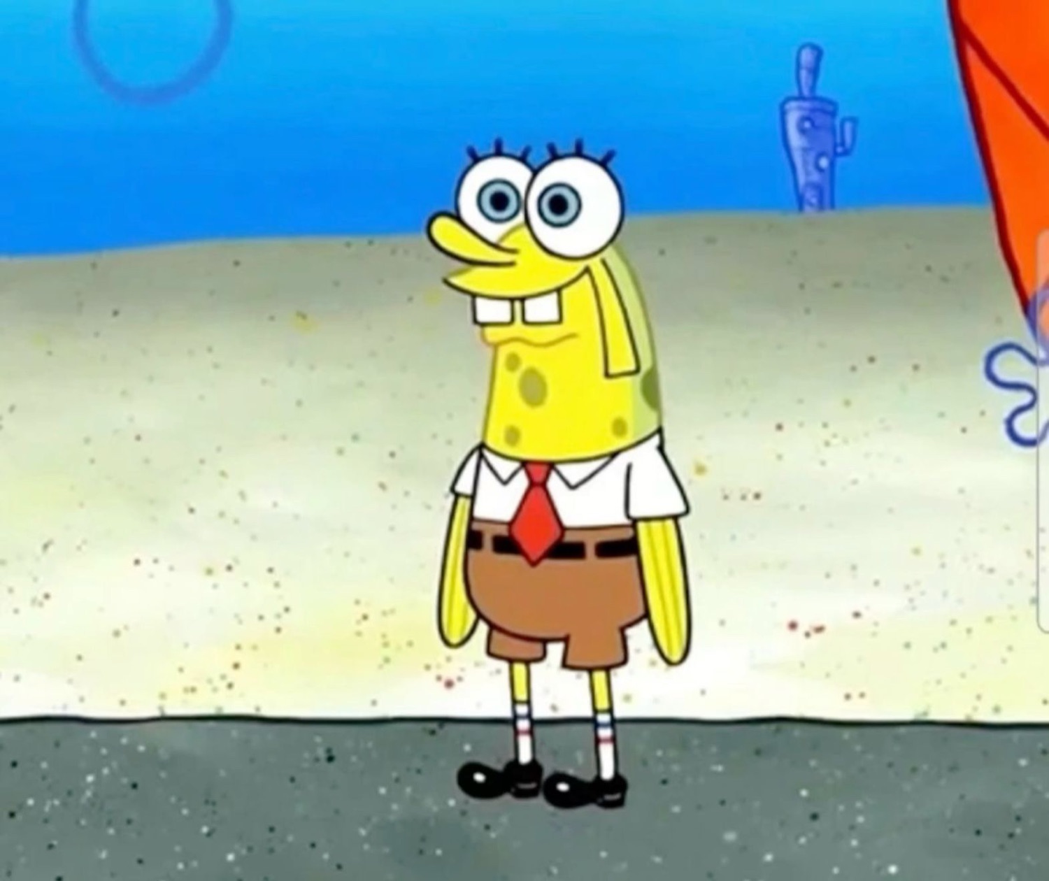 Skinny, stretched SpongeBob standing on the sand with a goofy face