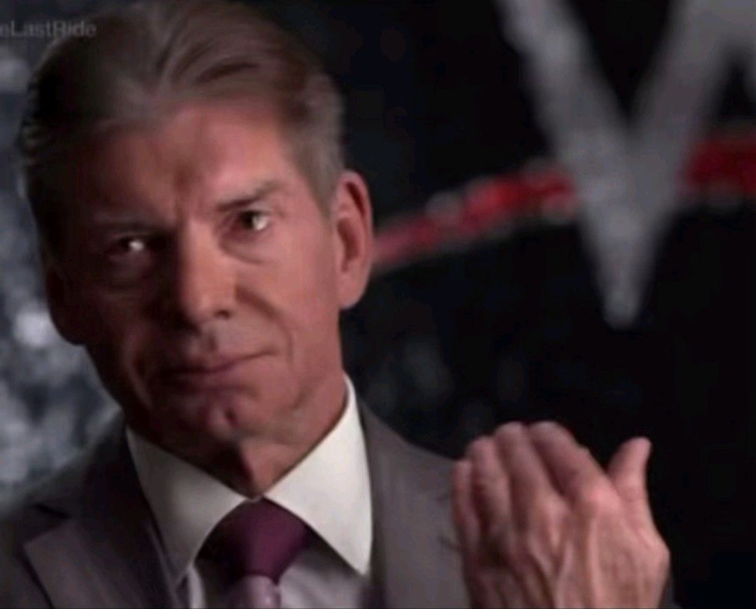 Vince McMahon gesturing at himself