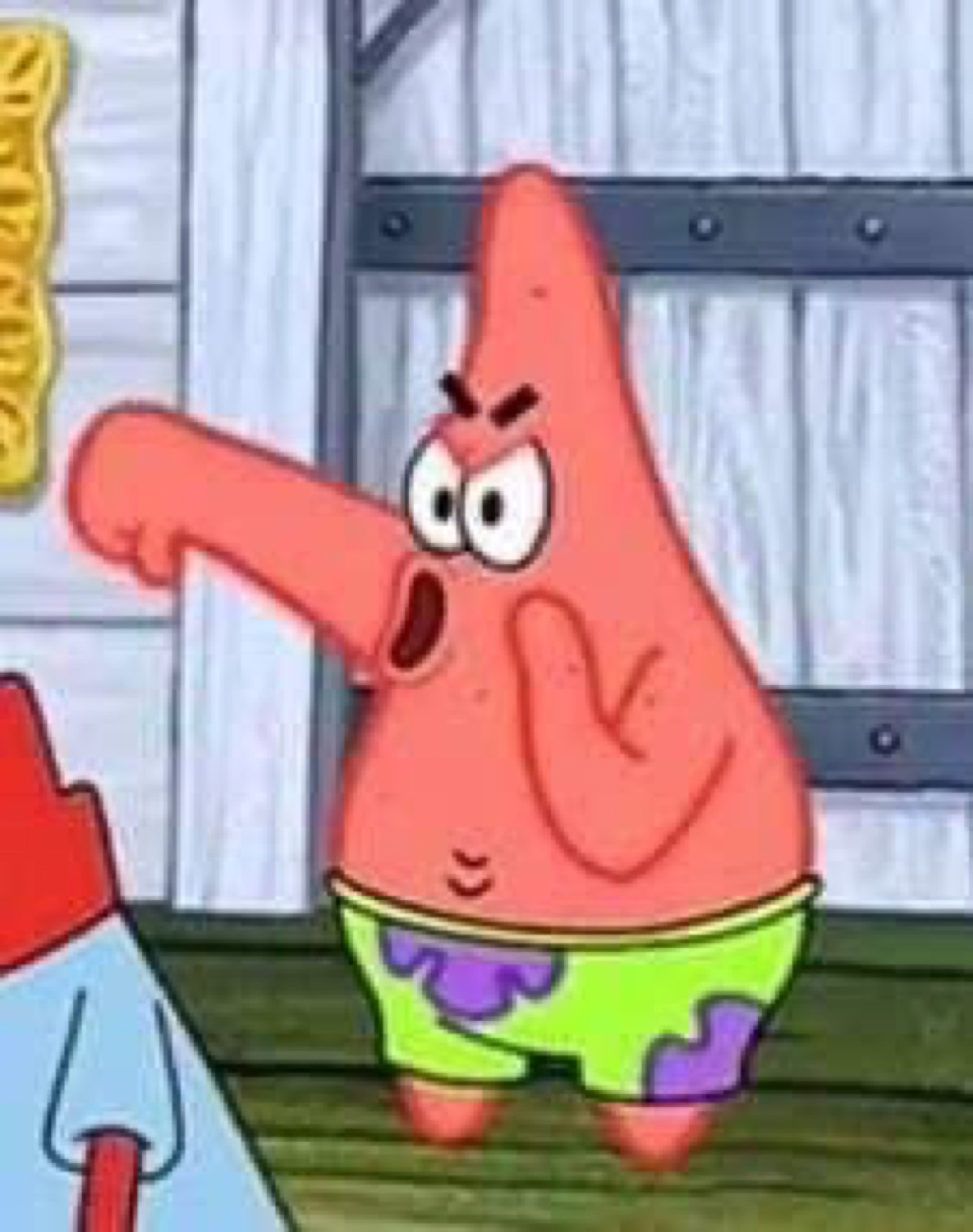 Patrick Star pointing with furious brows and an open yelling mouth