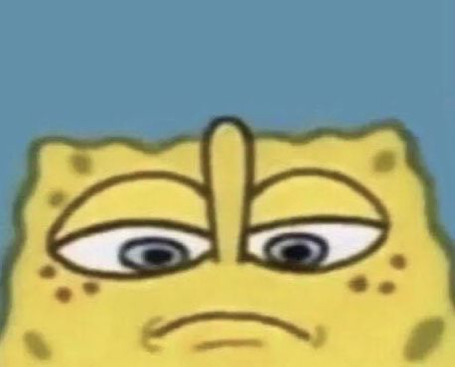 Close-up of SpongeBob's face frowning with unibrow and unimpressed eyes