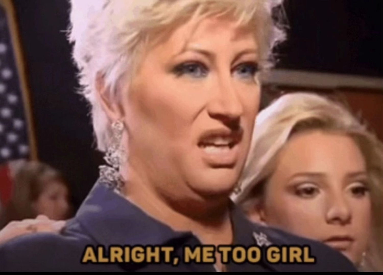 Blonde woman with a flat, over-it look, captioned 'Alright, me too girl'