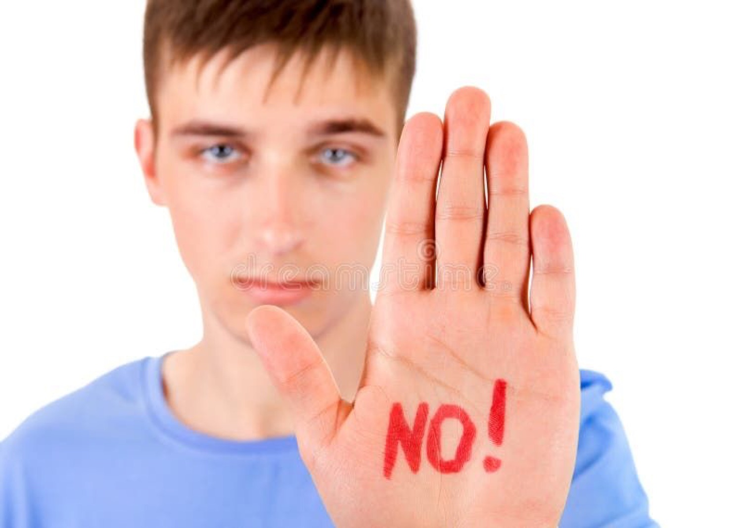 Young man holding up his palm with 'NO!' written on it