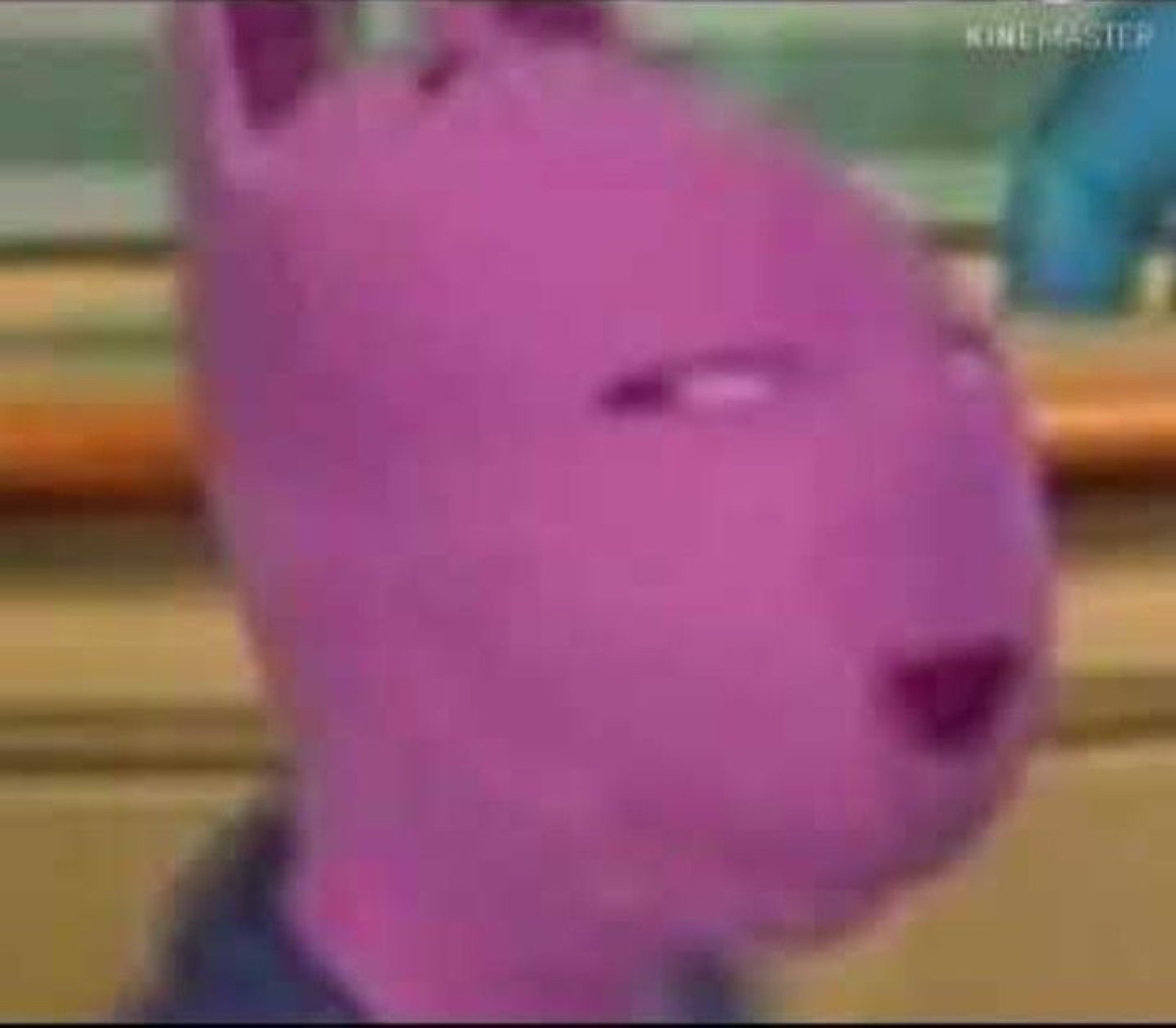 Blurry purple cartoon character with a heavy-lidded, thoroughly unbothered face