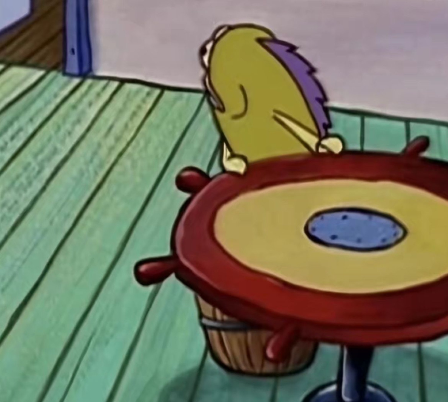 SpongeBob character slumped face-down on a table in silent despair