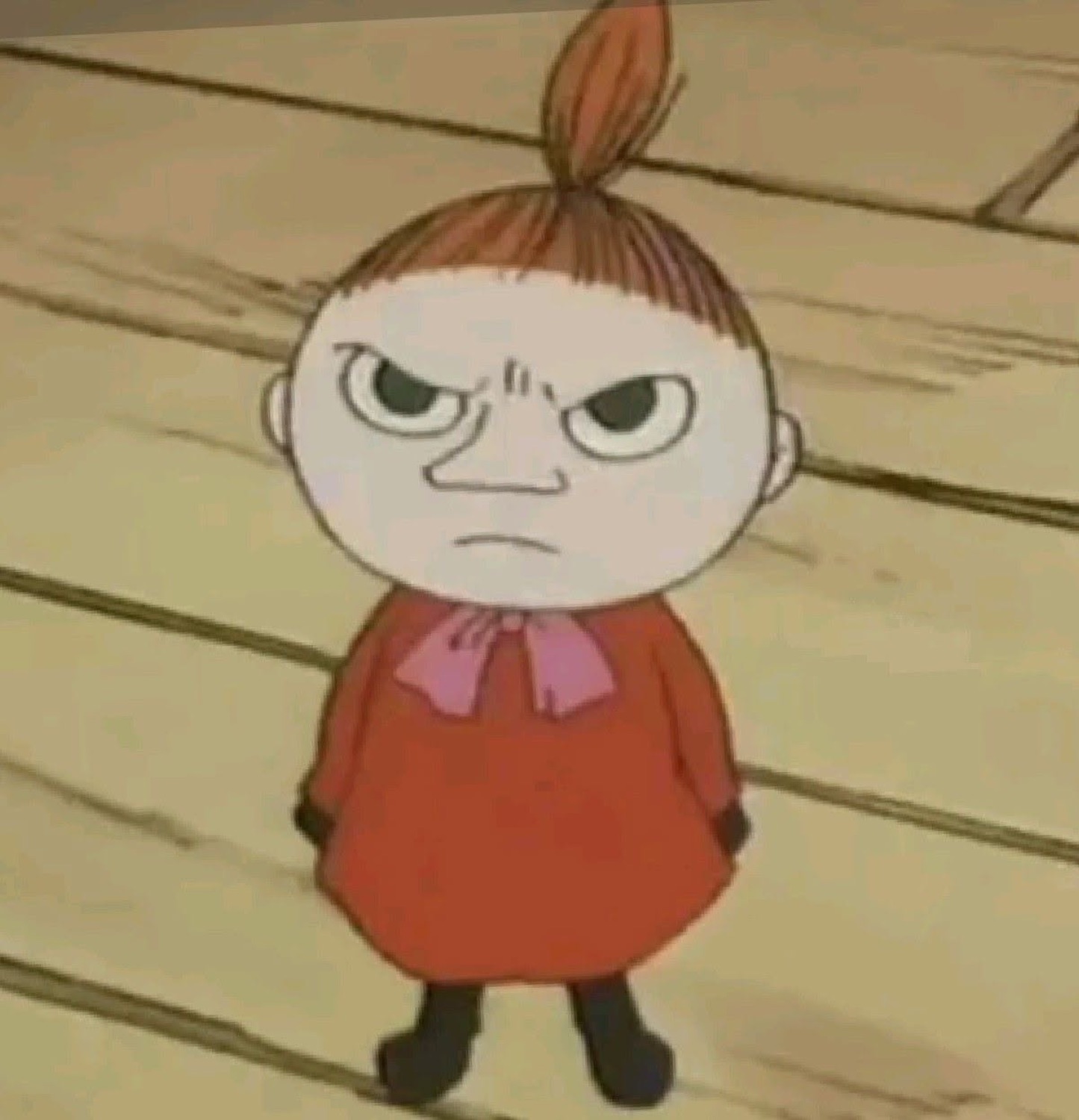 Little cartoon girl in a red dress scowling with a furious frown