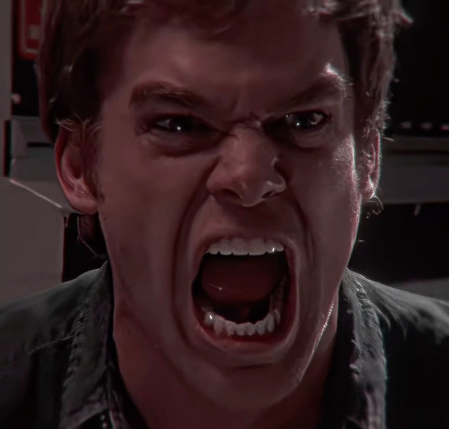 Man screaming at the top of his lungs with a furious, contorted face