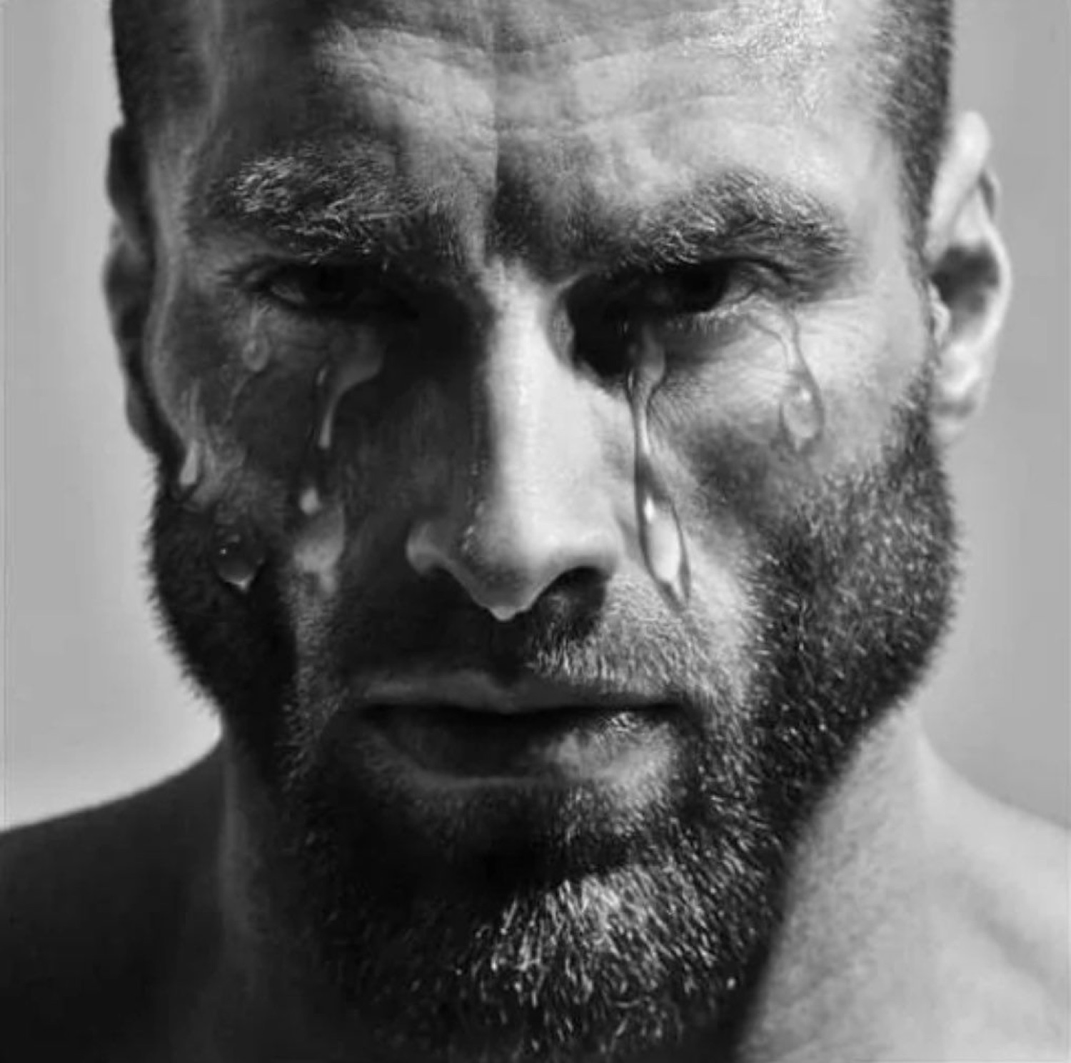 Gigachad with tears streaming down his face