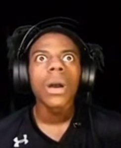 Streamer in headphones staring at the screen with mouth open and eyes totally bugged out in shock