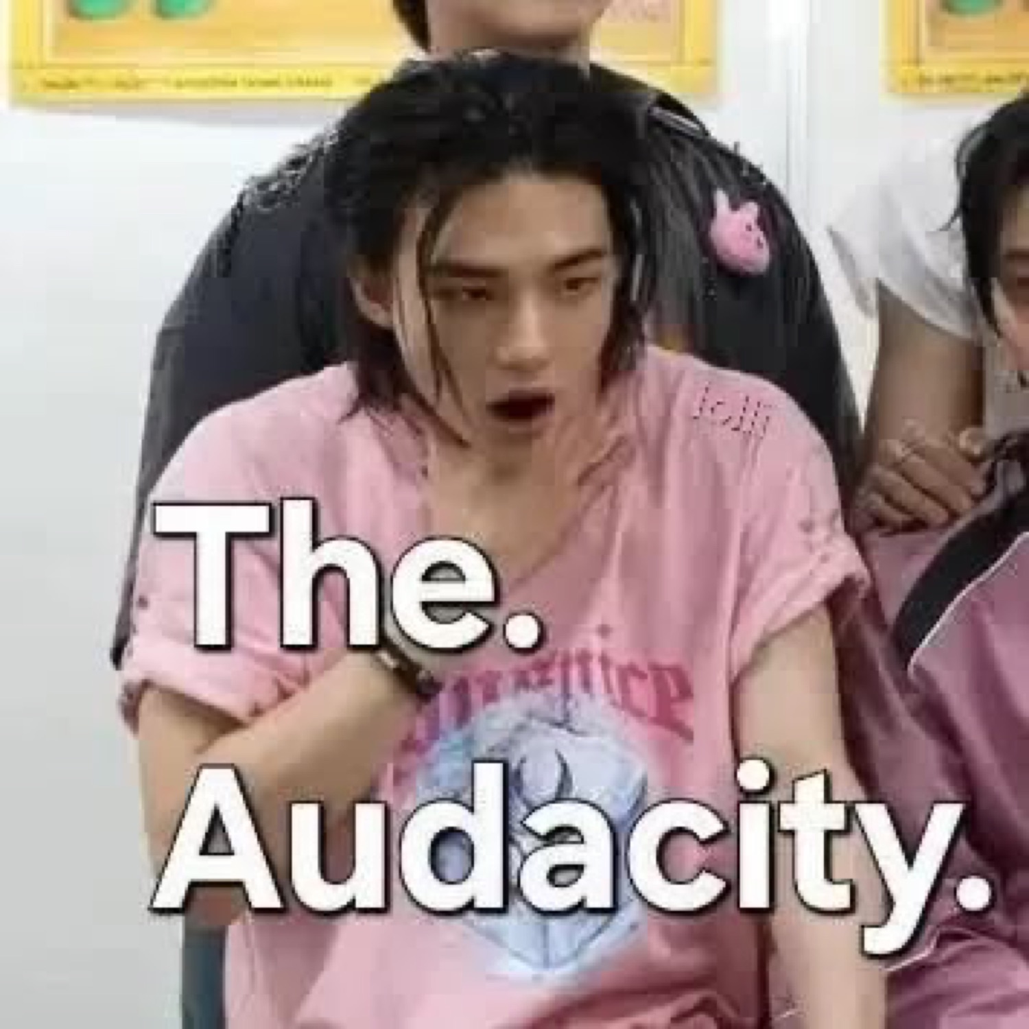 Guy in a pink tee with his jaw dropped, captioned 'The. Audacity.'