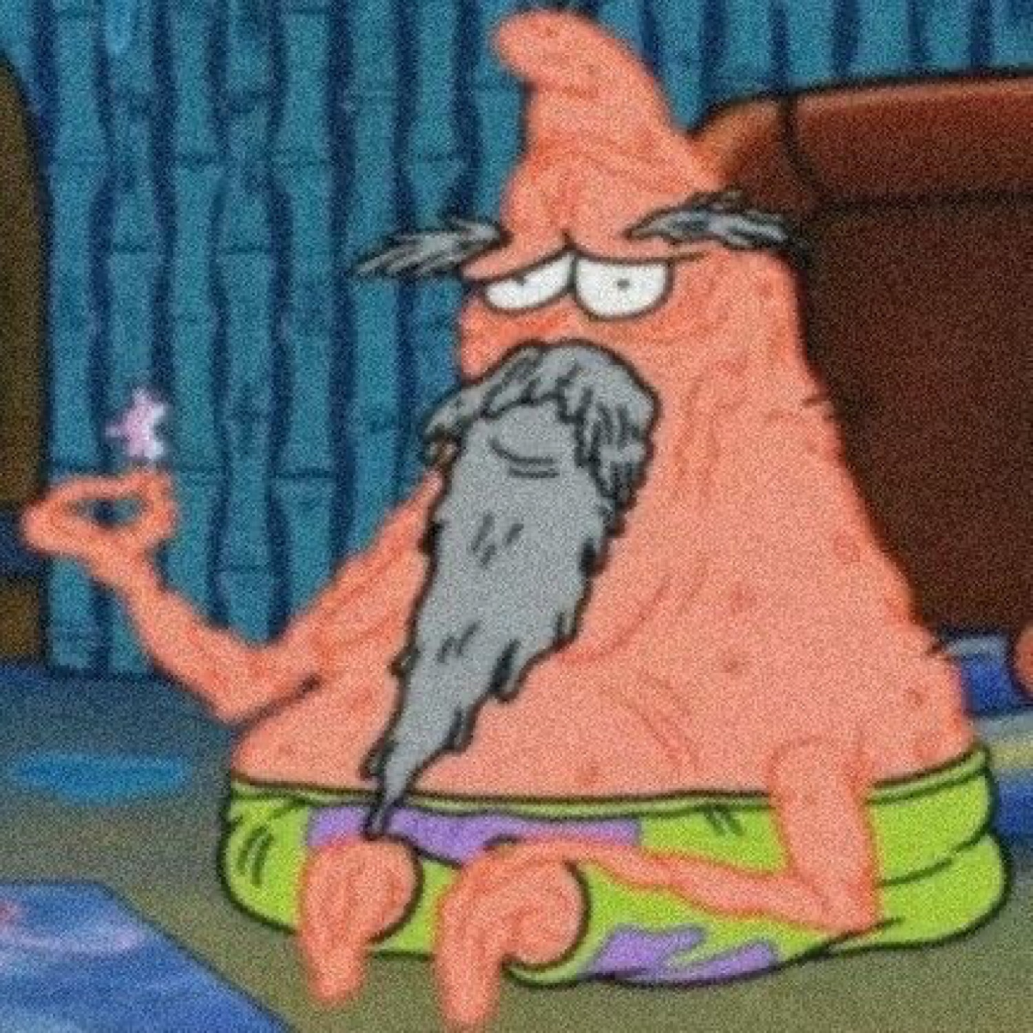 Wizard Patrick Star sitting cross-legged with a long gray beard and a knowing squint