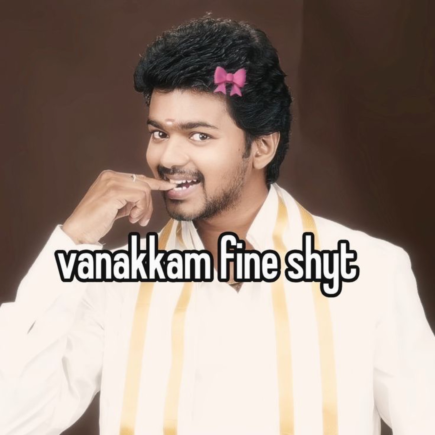 Vijay with a pink bow biting his finger: 'vanakkam fine shyt'
