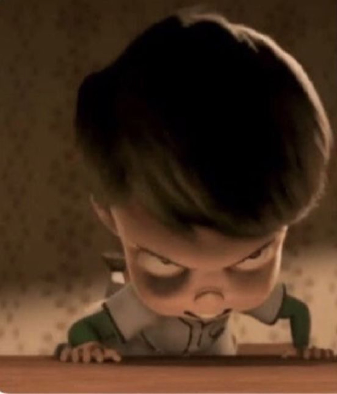 Animated kid with a bowl cut glaring furiously over the edge of a table