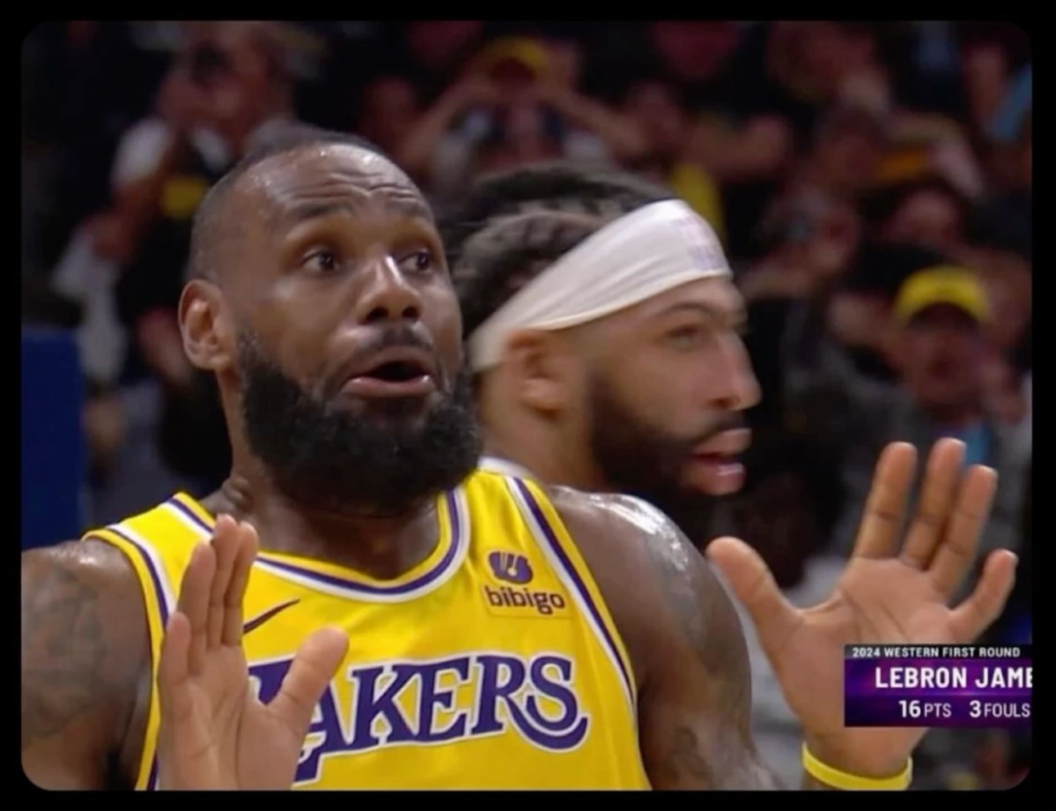 LeBron with his hands up in disbelief on court