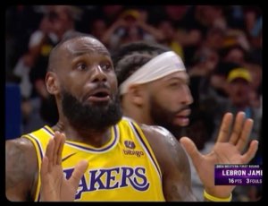 LeBron with his hands up in disbelief on court