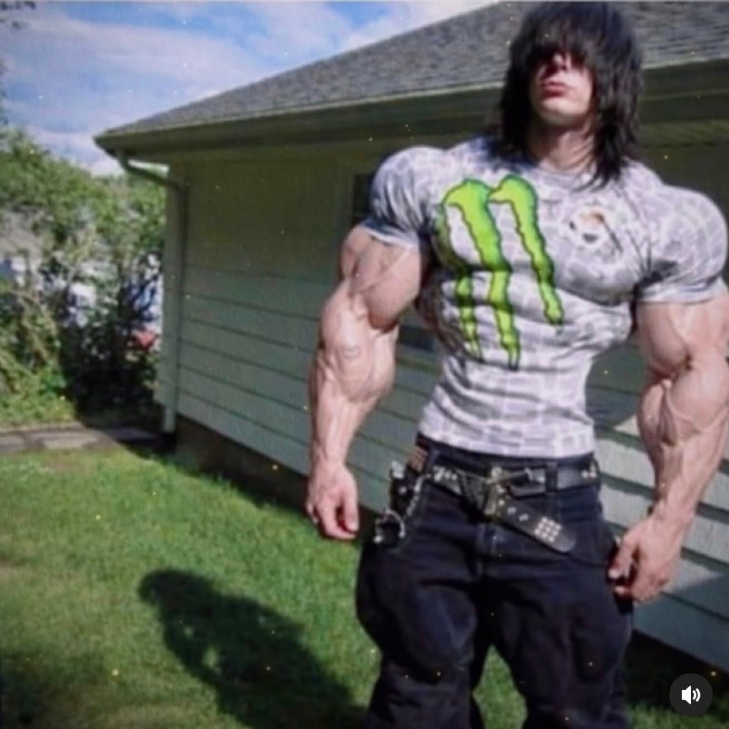 Emo guy with absurdly edited muscles in a Monster Energy shirt