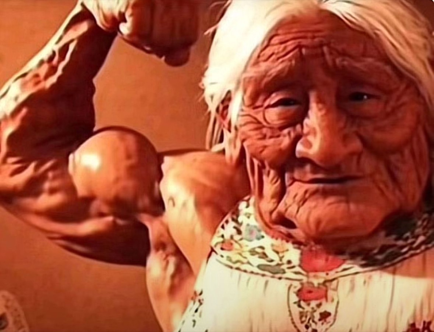 Old woman with enormous muscular arms smiling calmly