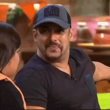 Salman Khan in a cap laughing