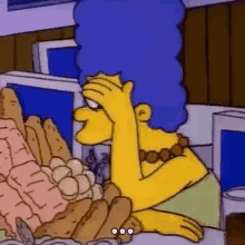 Marge Simpson at a table groaning in embarrassment
