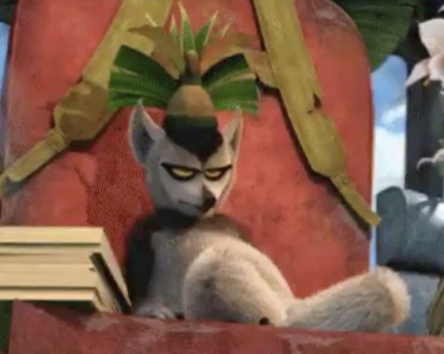 Lemur king slouched in his throne reading a book with a supremely unbothered, over-it face