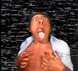 Man ripping open his shirt with his mouth wide open and tongue out in full chaos mode