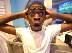 Man grabbing his head with jaw dropped in total disbelief