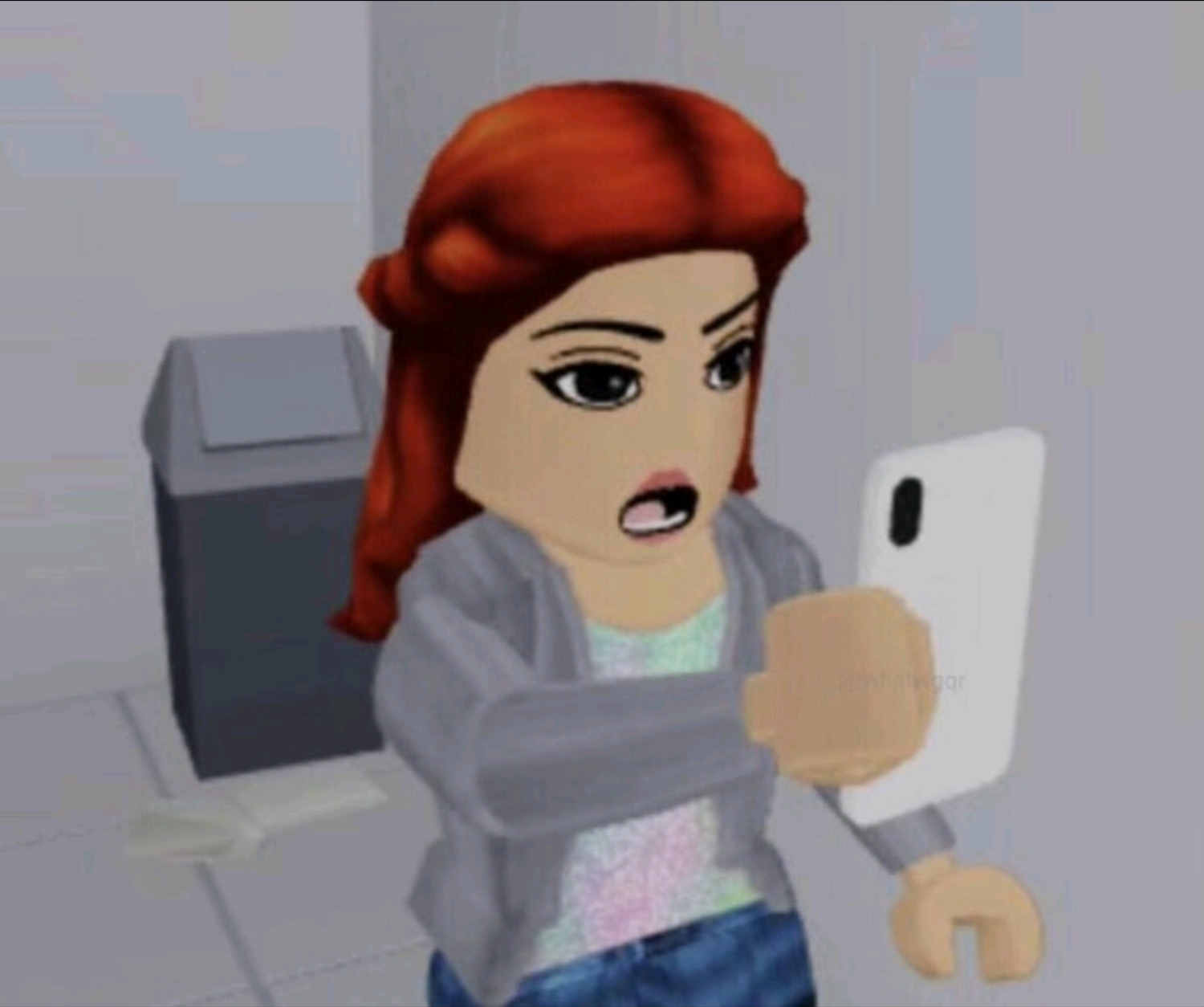 A red-haired Roblox avatar gasping in shock at her phone