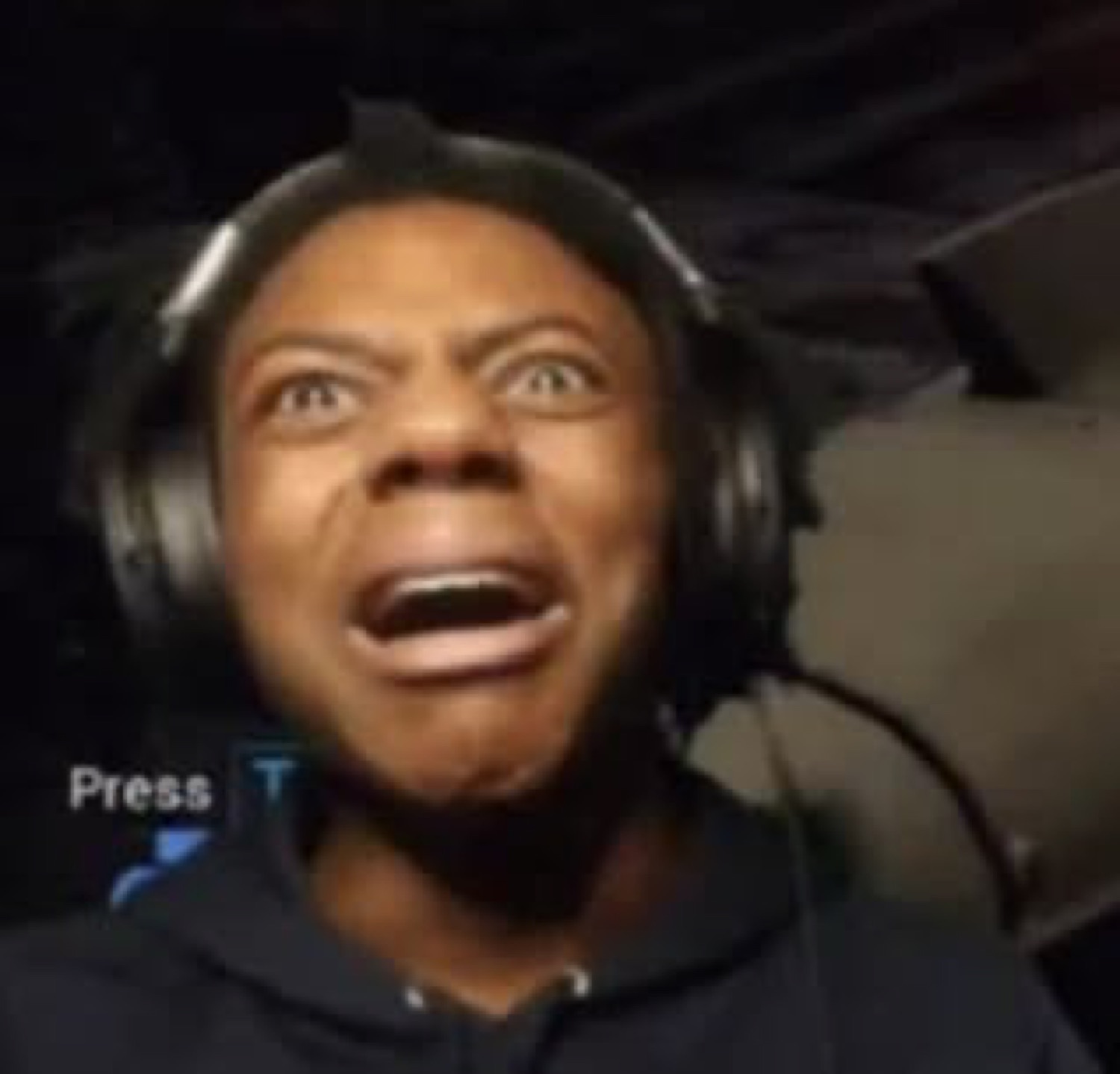 Gamer in headphones screaming wide-eyed at the screen with a 'Press' prompt in the corner