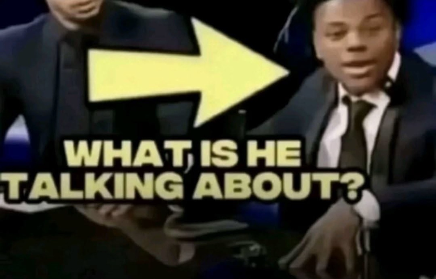 Big yellow arrow points at a suited young man captioned 'WHAT IS HE TALKING ABOUT?'