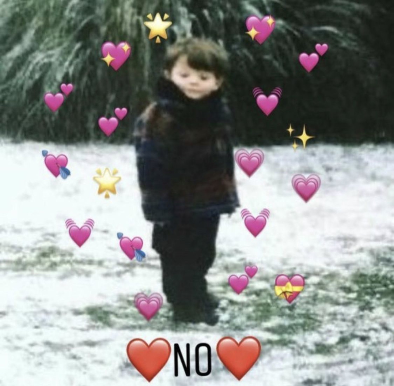Little kid standing alone in the snow surrounded by heart emojis, captioned 'NO'