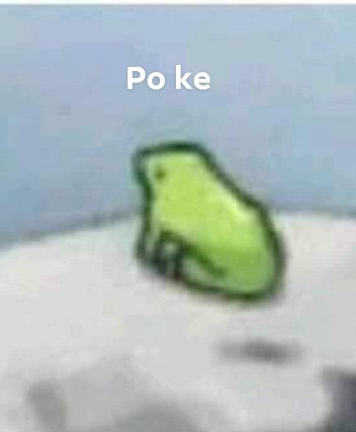Blurry green frog sticker sitting on a rock captioned 'Po ke'