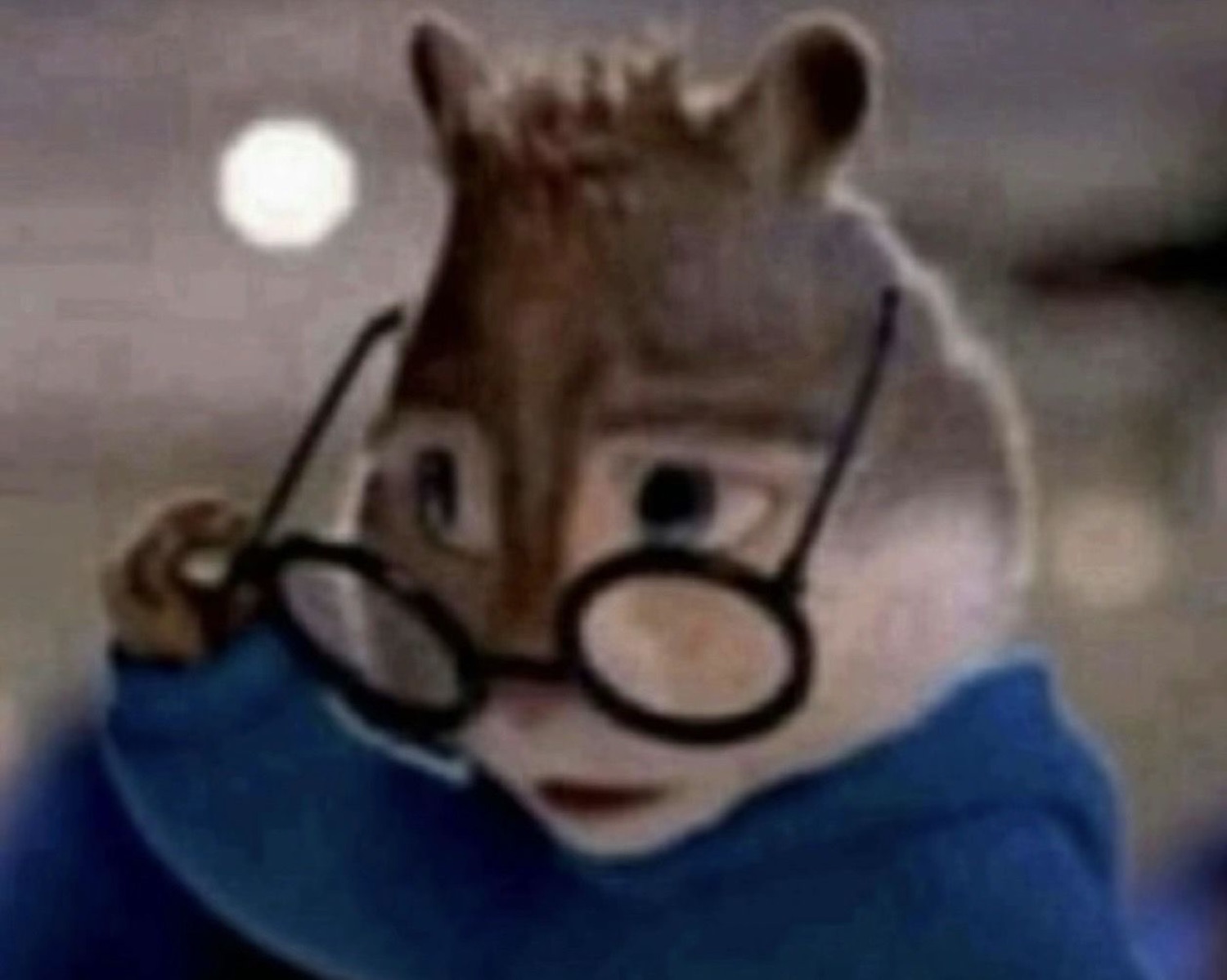 Simon the chipmunk peering over his glasses with a skeptical, judgmental look