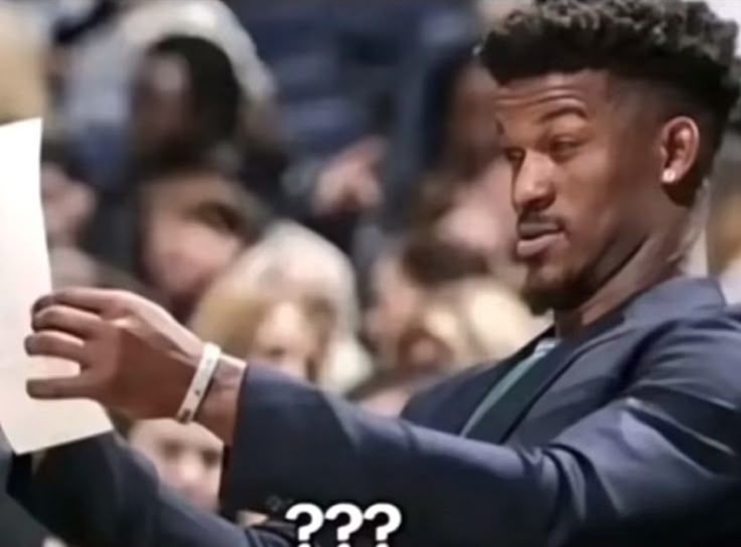 NBA star squinting skeptically at a sheet of paper captioned '???'