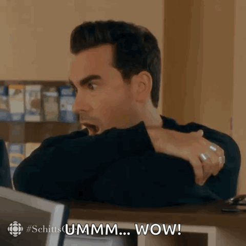 Dan Levy as David Rose leaning back unimpressed, "Ummm... wow!"