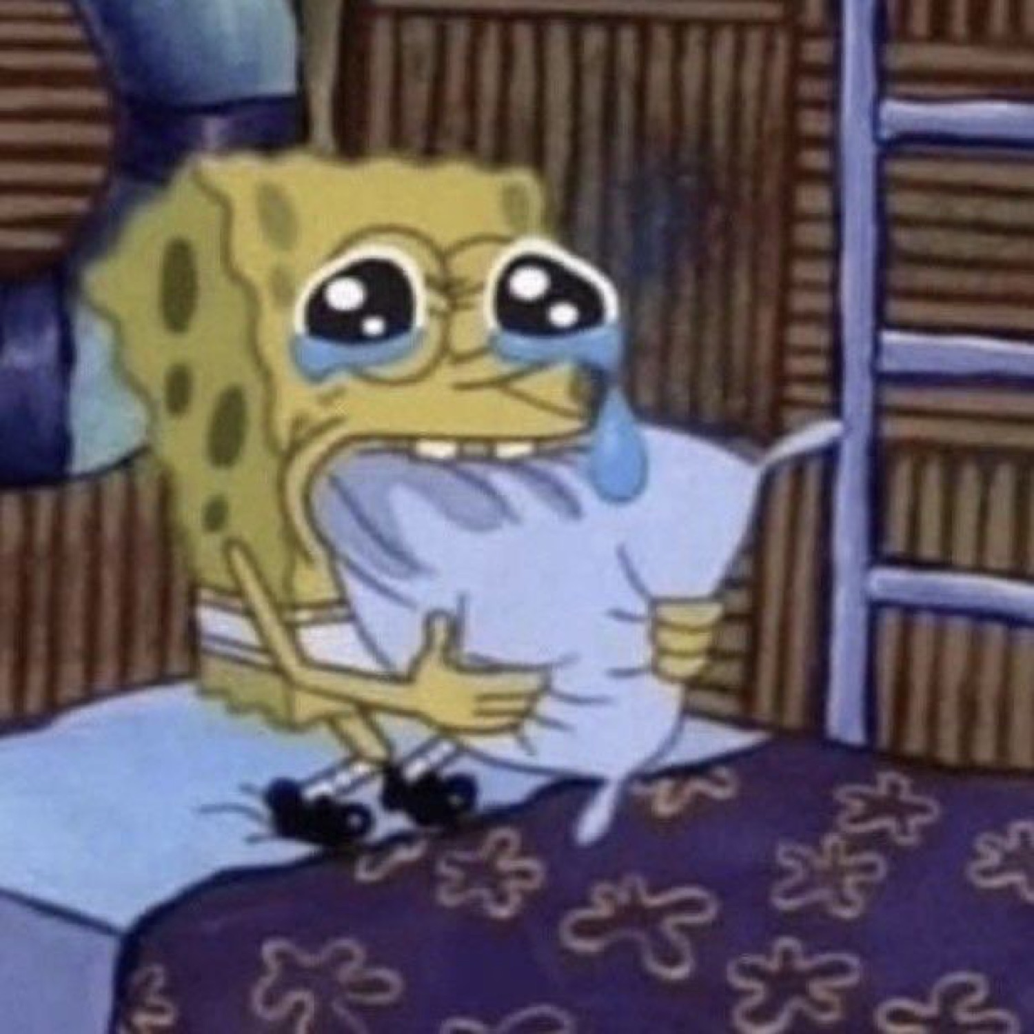 SpongeBob sitting on a bed sobbing with big teary eyes and a thumbs up