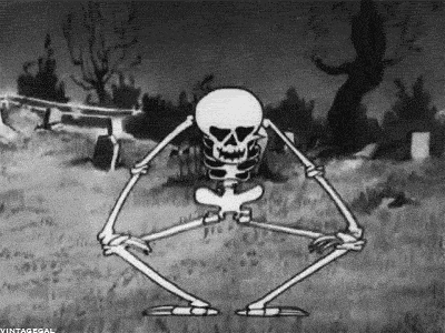 Black and white cartoon skeleton kneeling in a graveyard and playing its ribs