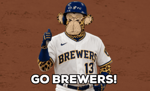 Brewers player with a cartoon monkey face hitting a home run, "Go Brewers!"