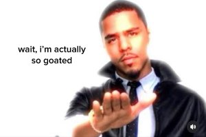 Suited man holding out his palm looking smug captioned 'wait, i'm actually so goated'