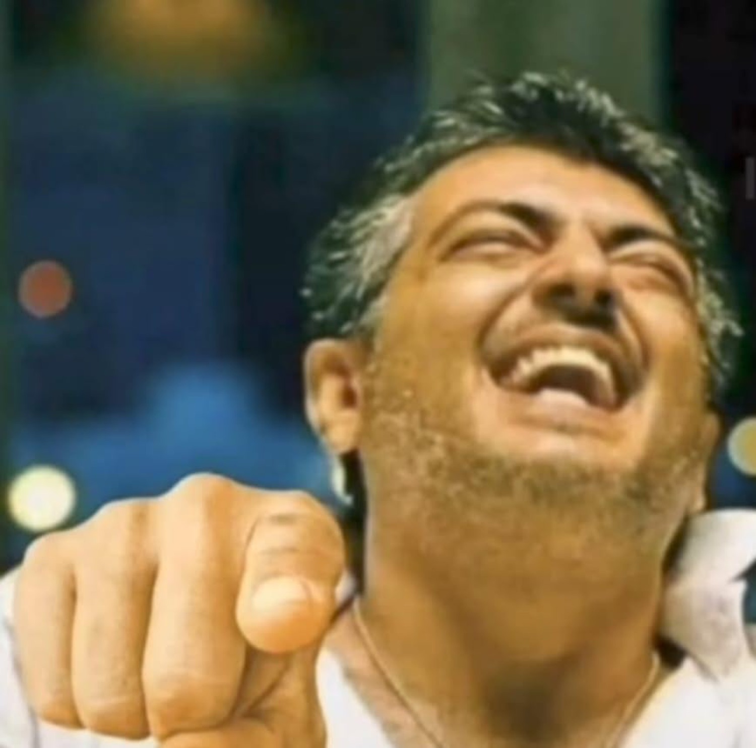 Ajith laughing and pointing at the camera